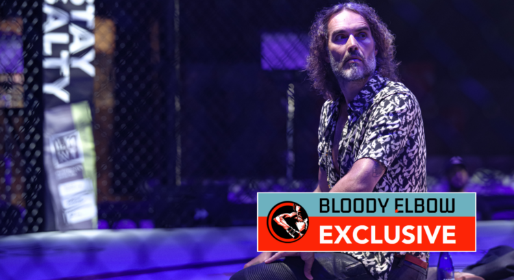 Russell Brand on his knees in the PFL cage. Overlay text reads: BLOODY ELBOW EXCLUSIVE